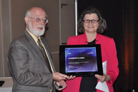 SPIE Vice President Maryellen Giger presents SPIE Fellow plaque to Laurence Clarke 