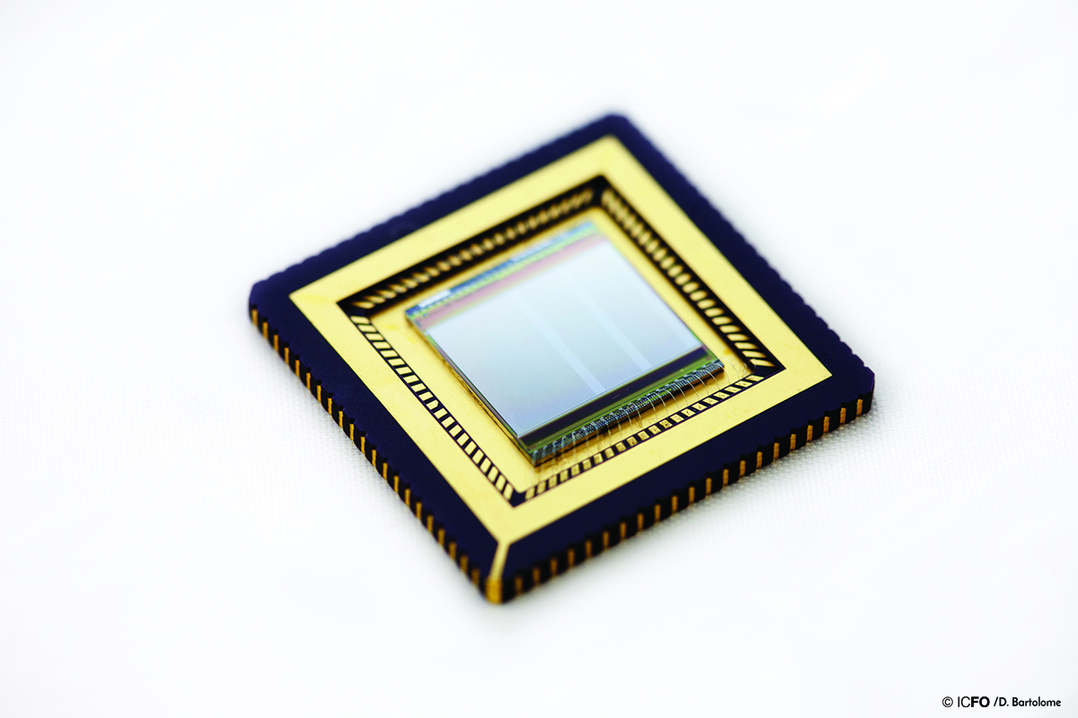 Silicon CMOS wafer with image sensor read-out circuitry, integrated with graphene/quantum dot photodetectors.