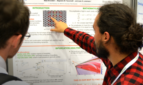 An RIT researcher shares his research in a poster session