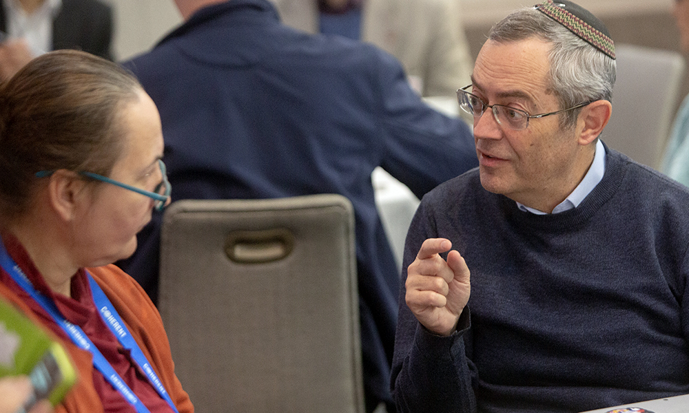 Two colleagues engage in conversation