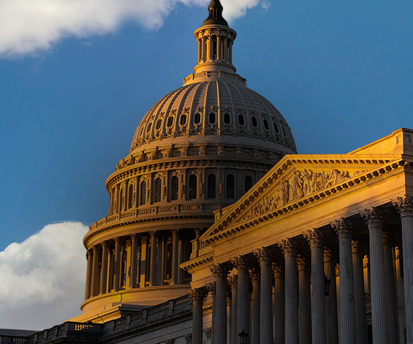 image of US Capitol Building with clouds and text overlayed