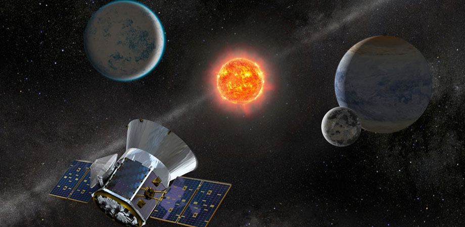 Artist concept of TESS observing an M dwarf star with orbiting planets. 
