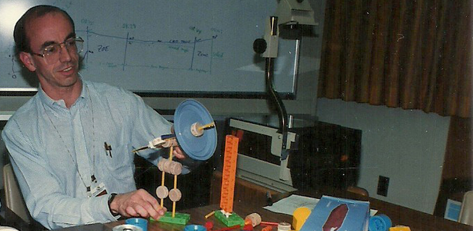 John Decker, in April 1990, building a Tinkertoy model that helped solve a Hubble Space Telescope high gain antenna anomaly 